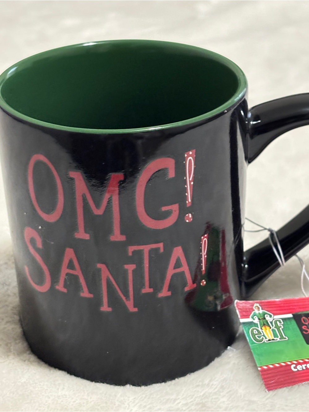 ELF Black Mug with Green Interior and Red OMG Santa Text